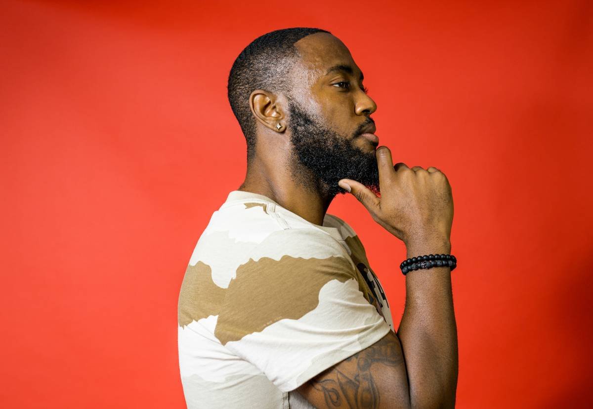 a man with a beard and a white shirt