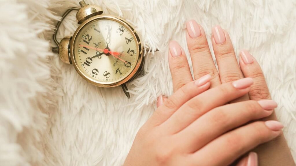A woman posing her hands with newly polished nails.