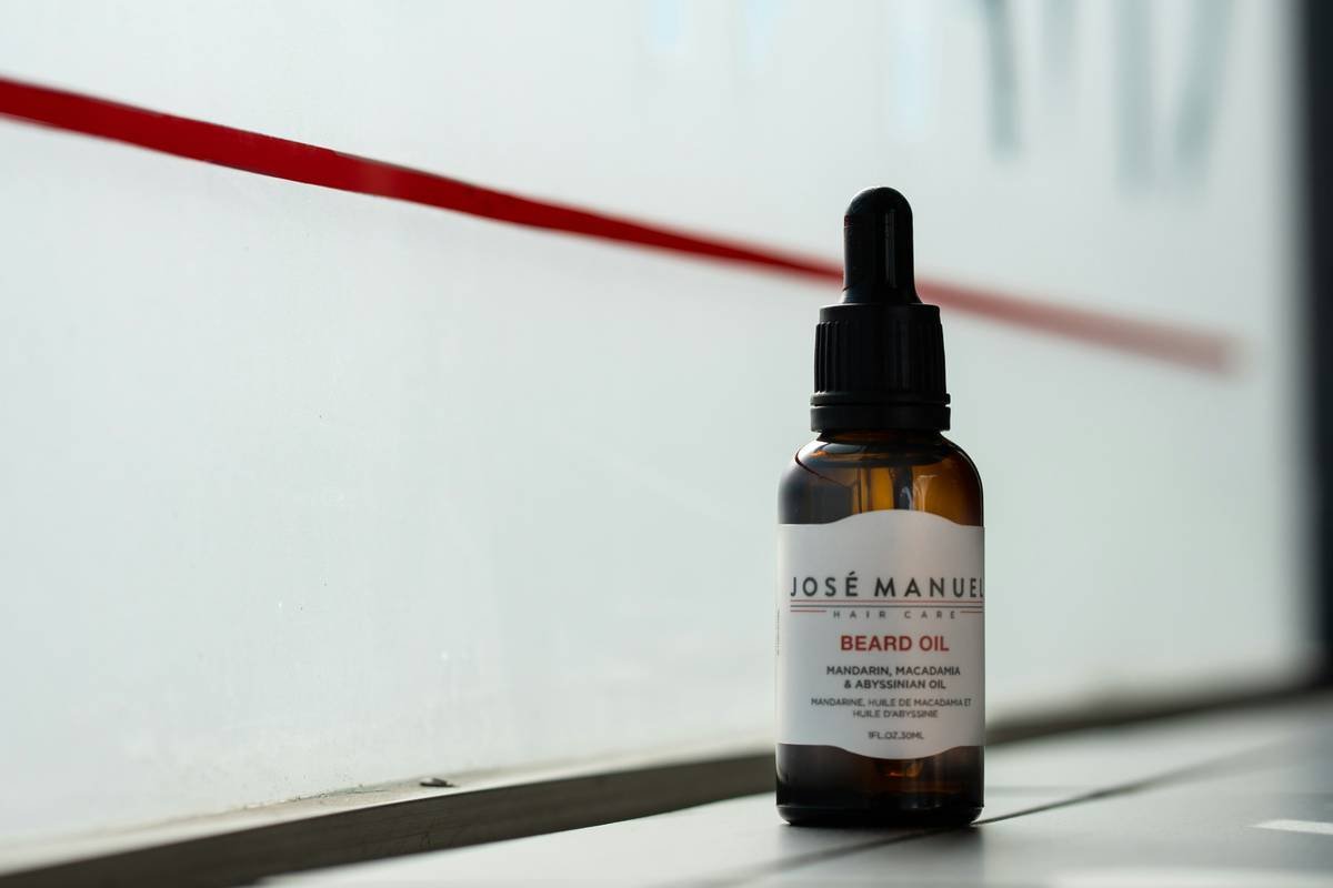 Man applying beard oil moisture boost to a dry, patchy beard showing immediate absorption and softening effect
